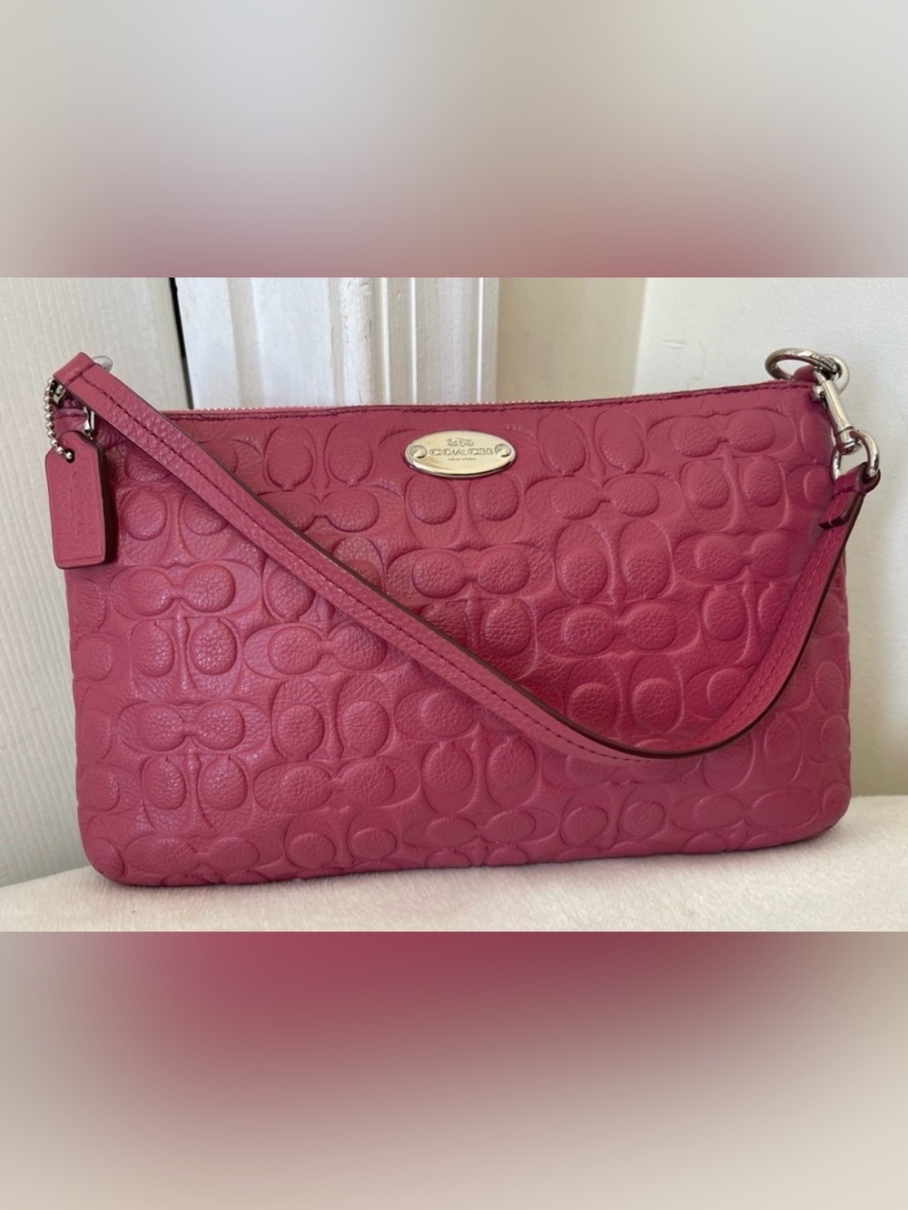 Coach Pebbled embossed Signature large Wristlet in pink